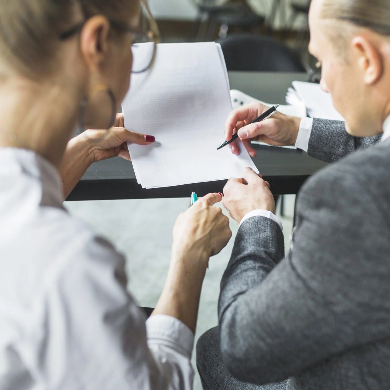 attorney-reviewing-document-with-client